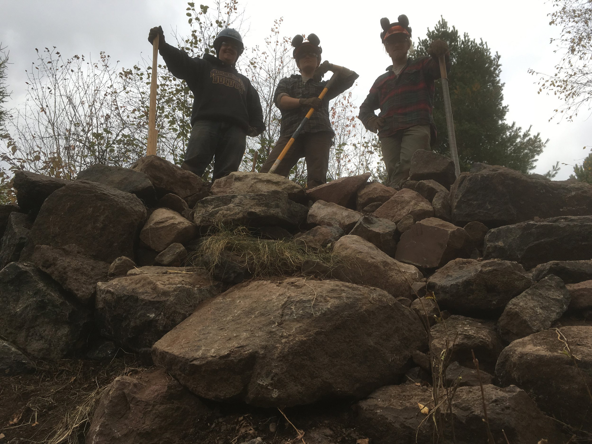 standing on top of rock pile