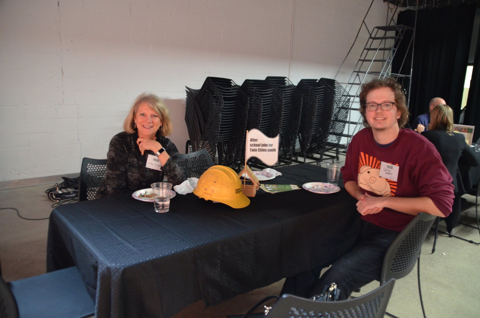 Two people sitting at table