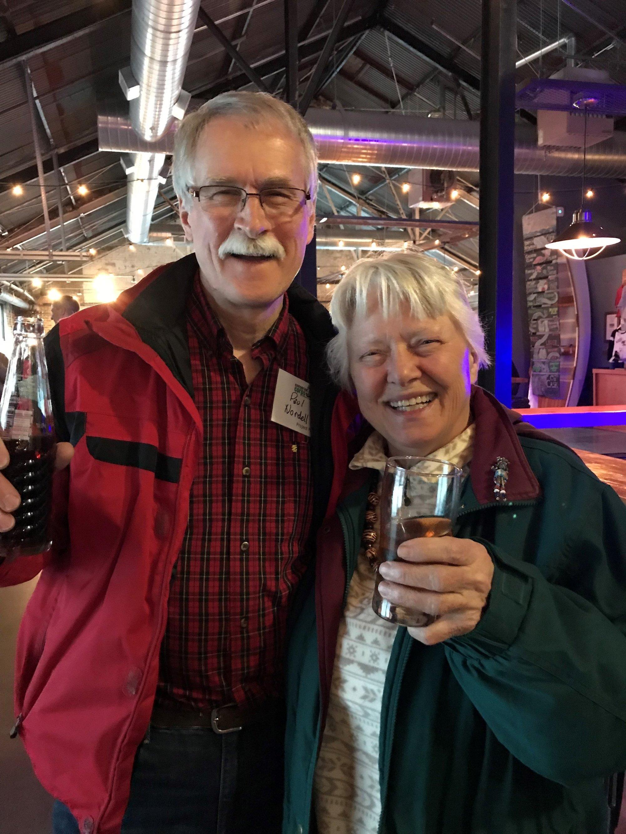 Two people smiling at camera