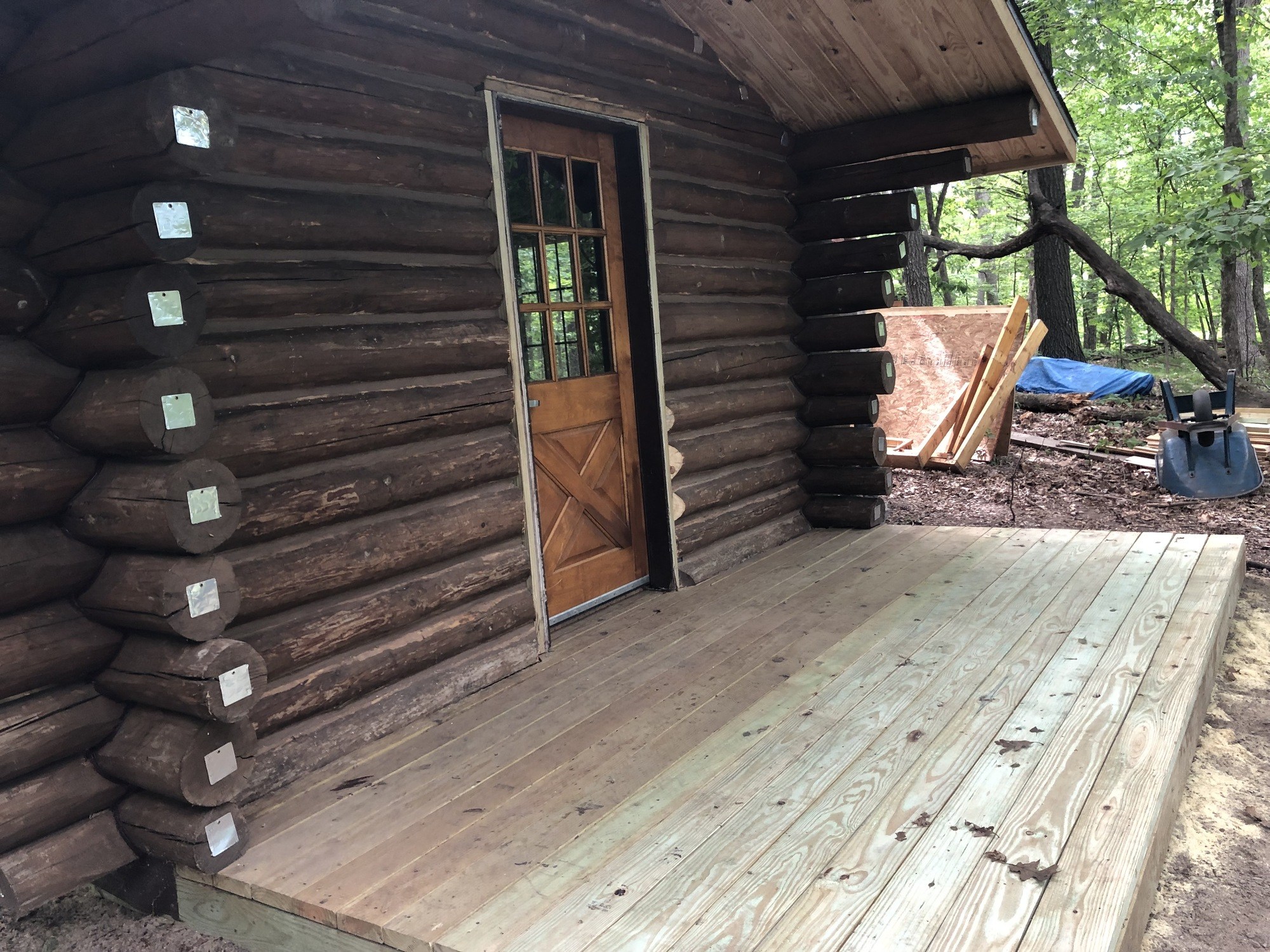 front door of completed cabin in spring