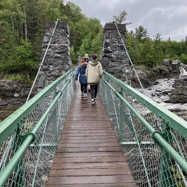 walking across bridge