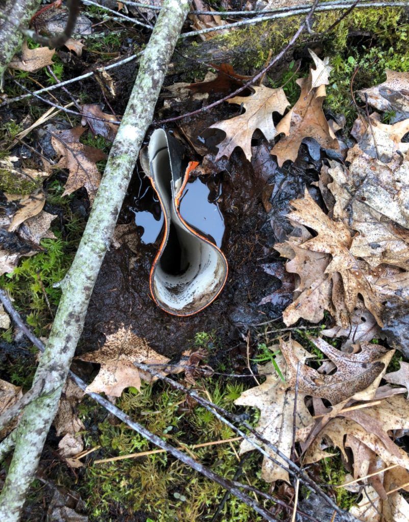 a boot sunken in muck