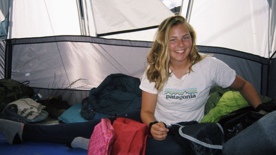 Person sitting in tent