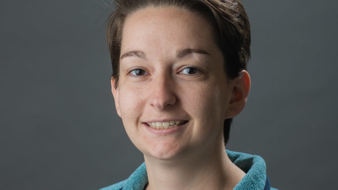 Headshot of person smiling at camera