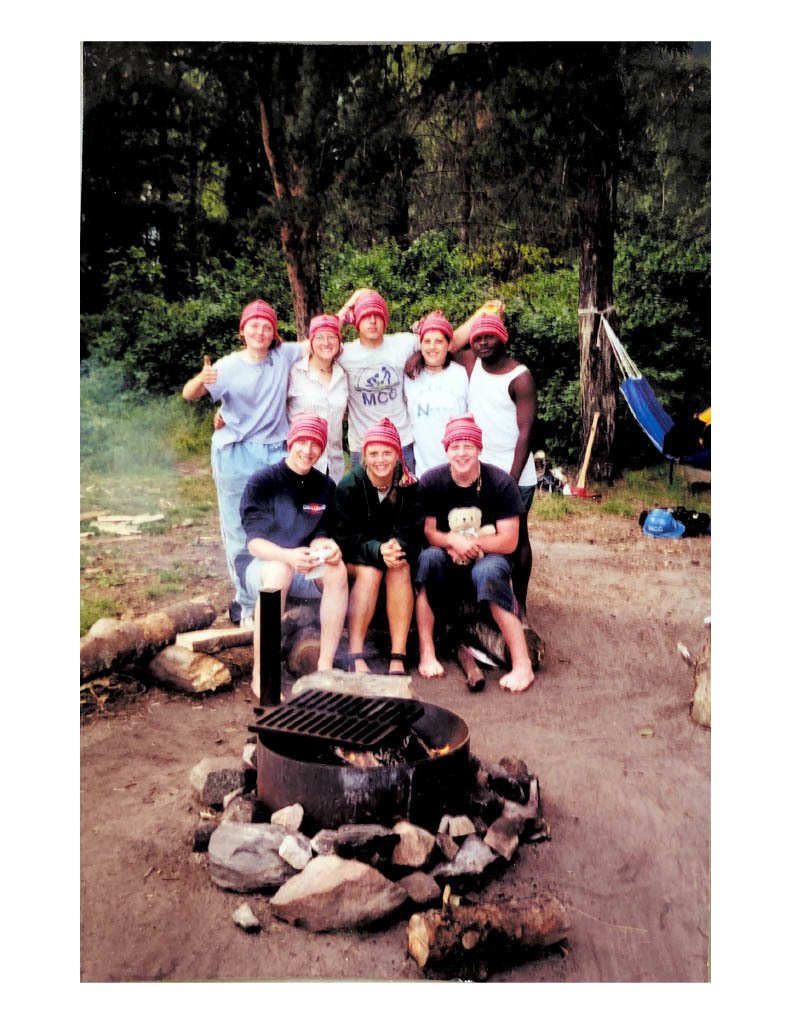 scanned photo of group of young adults at campsite