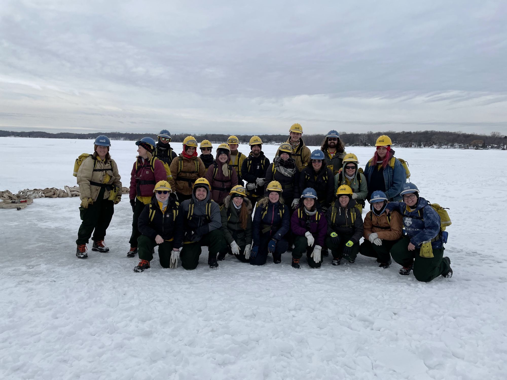 Group photo in fire gear on snowy field