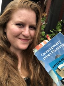 selfie holding a textbook