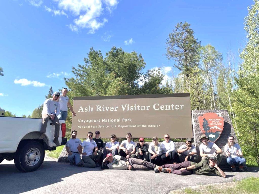 group in front of Ash River Visitor Center sign