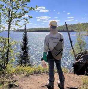 member looking out across northern lake