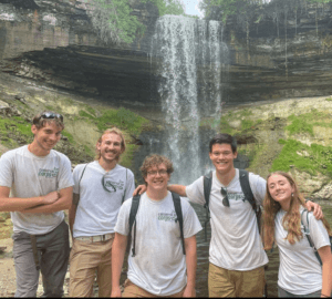 5 CCMI members in front of waterfall