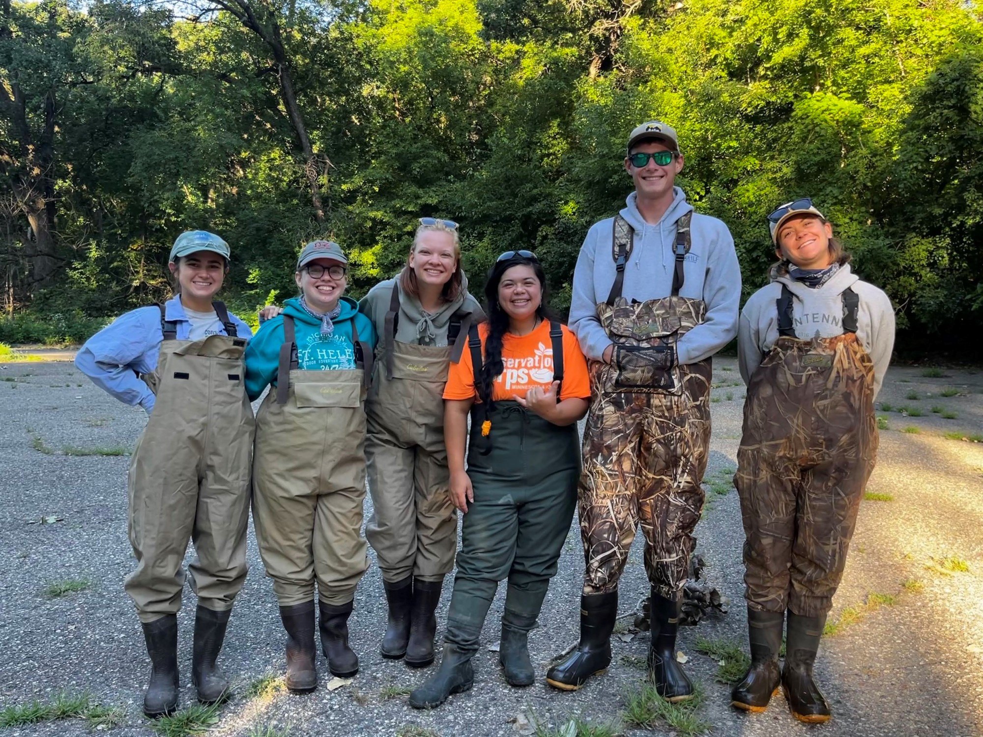 group photo of crew in waders