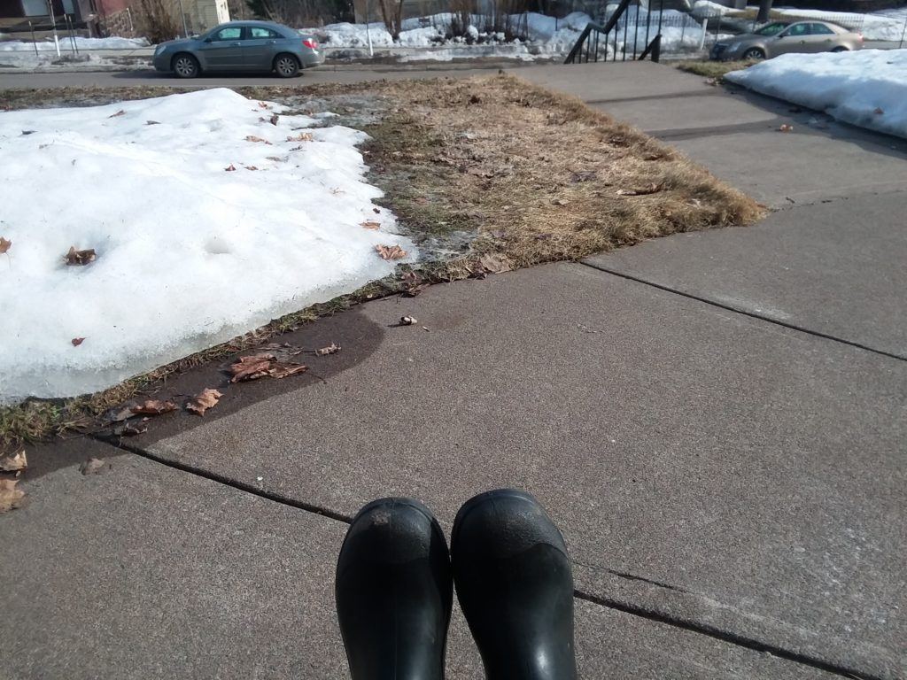 rubber boots and melting snow