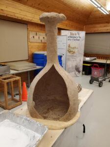 A paper mache structure on a table.