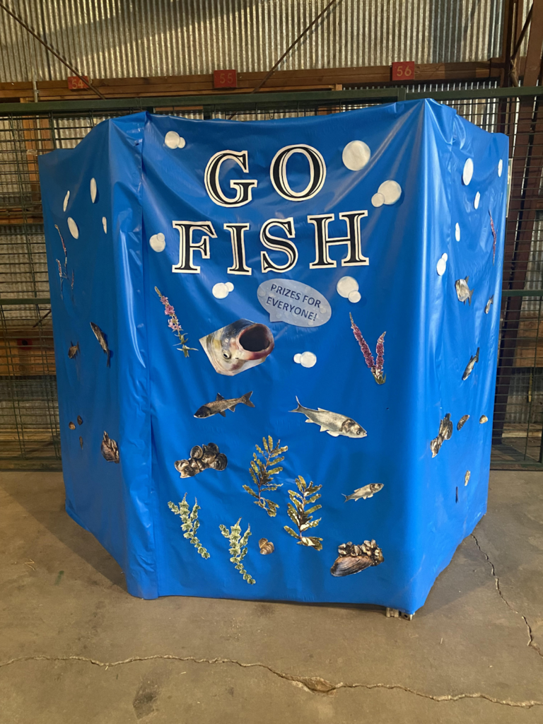 A tall blue bin labeled "Go fish"