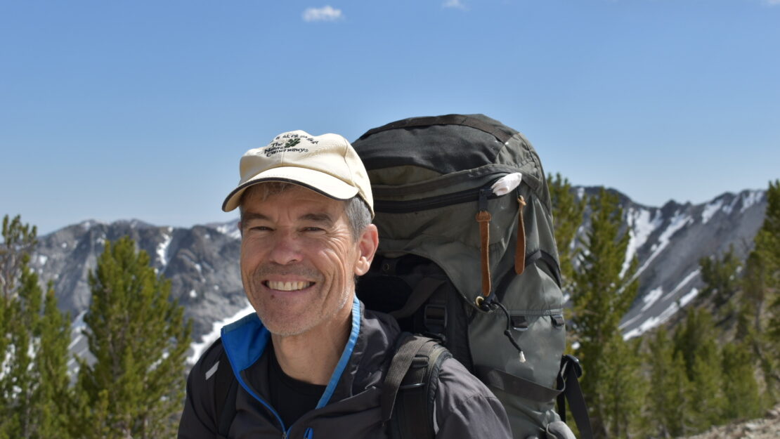 Mark Murphy with hiking backpack and smiling