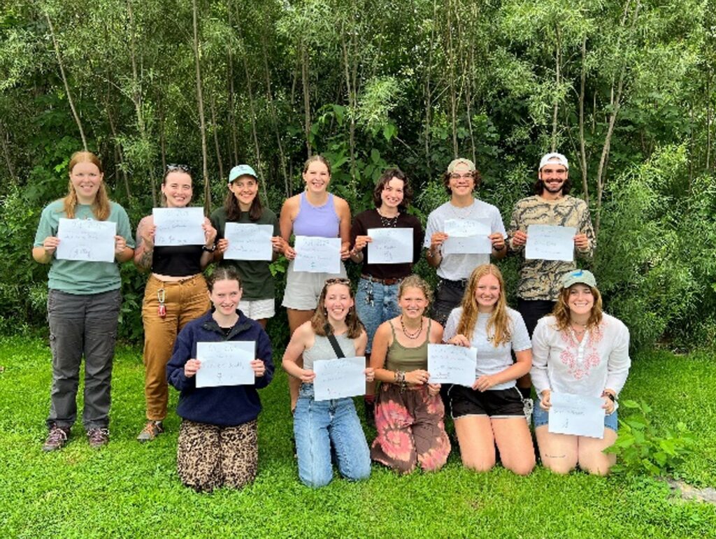 A group of people all holding certificates.