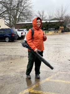 A person using a leaf blower