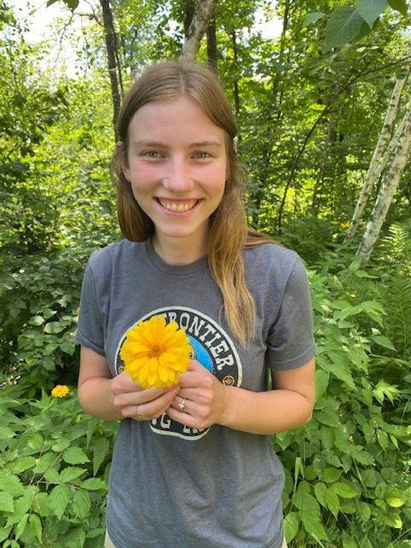 a person holding a flower.