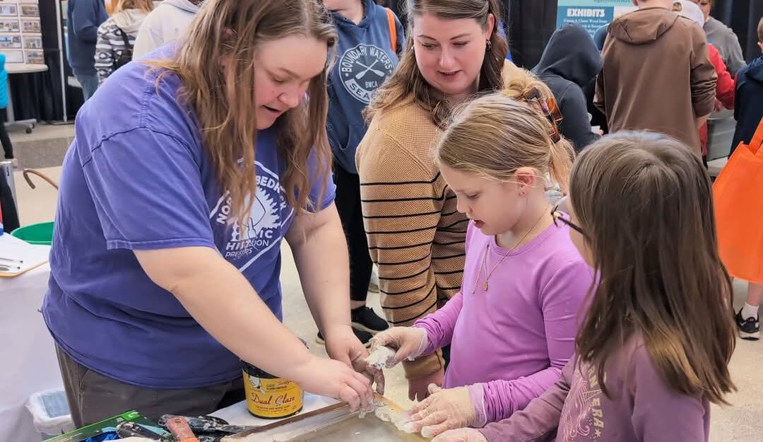 A person at a a children's educational booth.