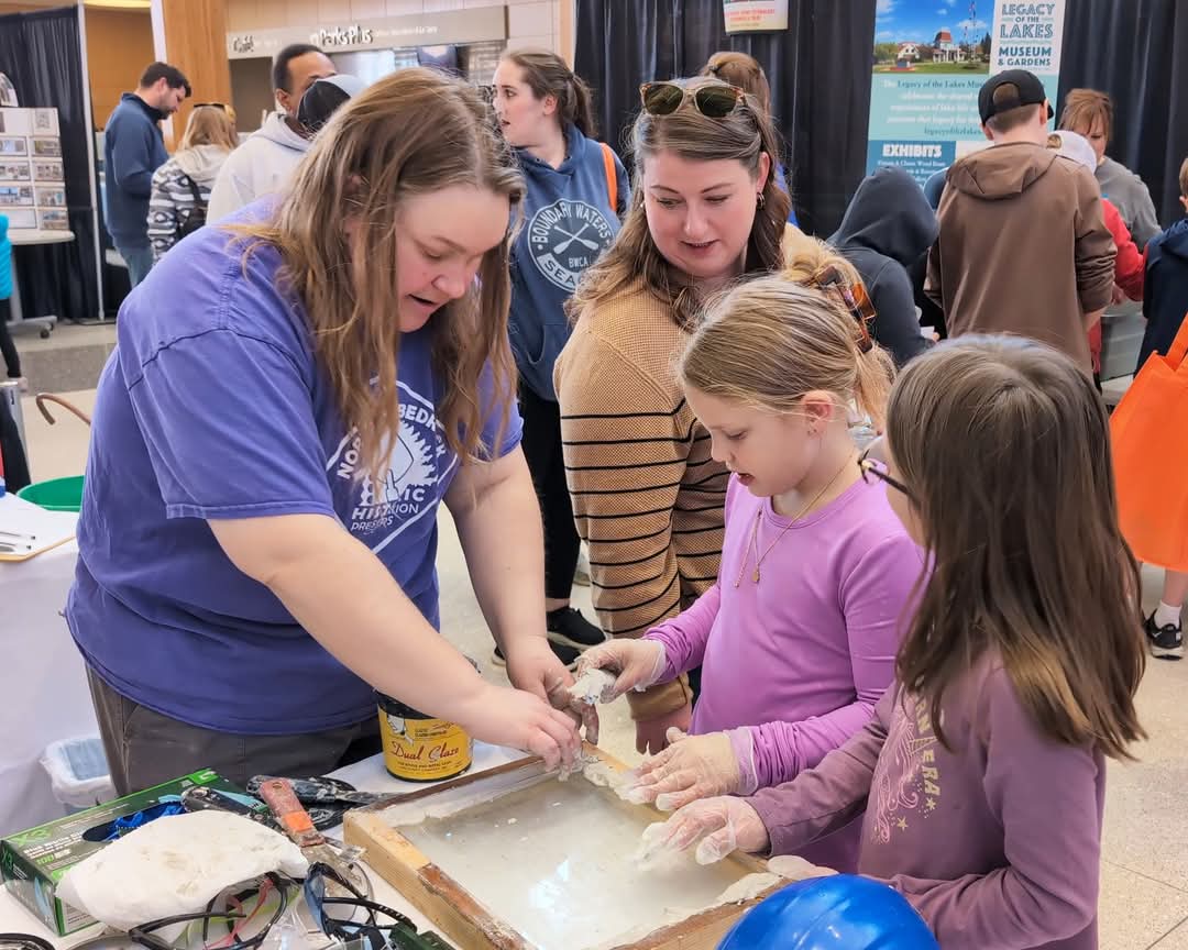 A person at a a children's educational booth.