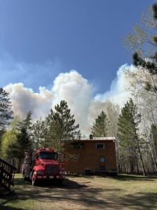 smoke rising above a forest.