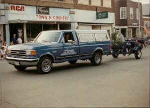 A pickup truck in a parade